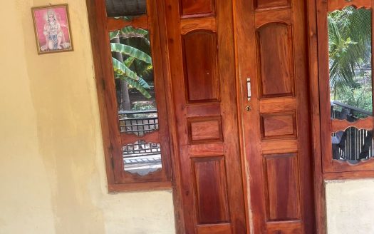 Land with house for sale in Kaithadi
